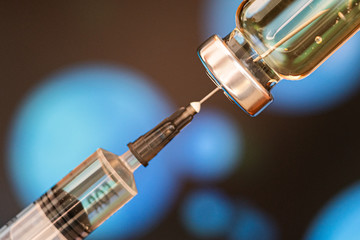 Syringe with a vaccine. Medical flu shot concept. injection bottle for medical glass vials