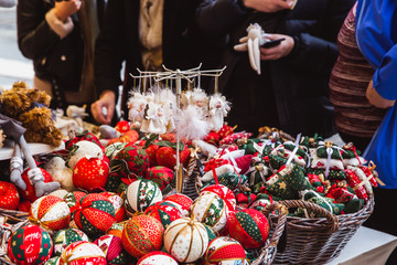 Kiosk with Christmas decorations made in Hungary in the beautiful Christmas Market at St. Stephen's Square in front of the St. Stephen's Basilica in Budapest