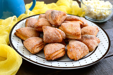 Tasty curd cheese cookies on a plate. Goose foot cookies. Homemade cakes for breakfast.