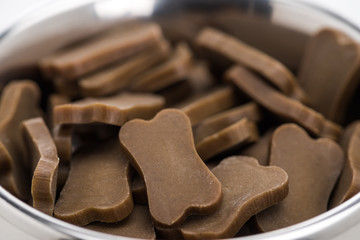 close up view of fresh dry pet food in bones shape