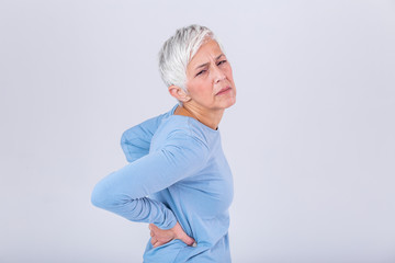 Matur Woman suffering from lower back pain. Mature woman resting with back pain. Female lower back pain. Senior woman injury suffering from backache