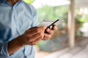 Males hand Paying online with credit card	