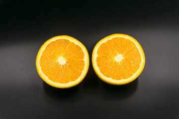  Organic freshness Orange fruit cutting taste sweet and sour on isolate black background