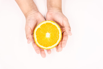 Organic freshness Orange cutting on kid hand Isolated white background