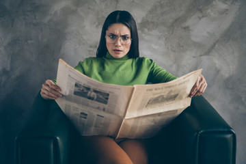 Photo of outraged shocked woman in stupor reading fake terrible headlines news about her...