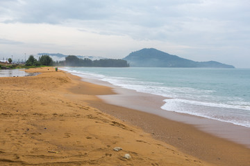 Yellow sand on the shores of the Andaman Sea, Waves in Thailand