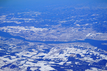 Naklejka na ściany i meble Aerial view of Quebec City, Canada, and the Saint Lawrence River under snow in winter