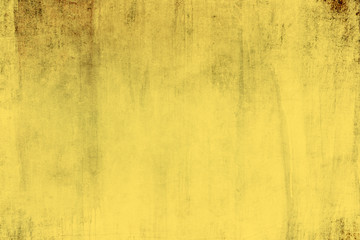 Old grungy yellow wall background or texture