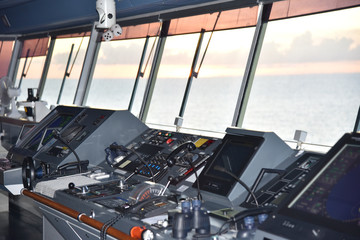 View of the control console on the navigational bridge of the cargo ship.