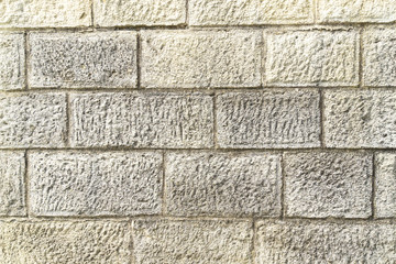 Yellow crimean sawn limestone - traditional porous heat-insulating stone for walls, hedges and construction in Feodosia, Crimea. Natural material known since antiquity. Nature concept for design