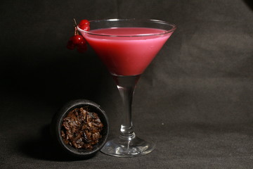 bowl with tobacco for hookah. fruits on a dark background. smoking nargile