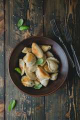 Dumplings, pelmeni, ravioli, pierogi on the table