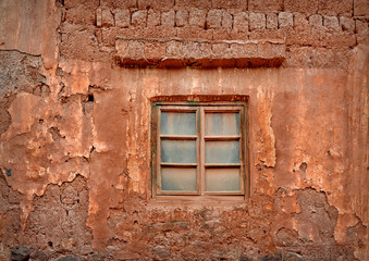 Fototapeta na wymiar Window in an abandoned house in Nuodeng village, China