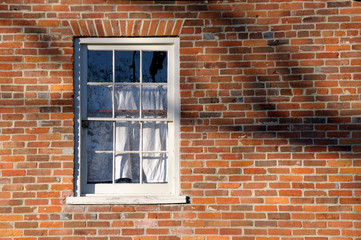 Window in Brick Wall and Tree Shadows