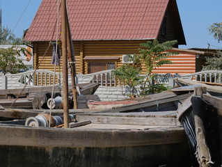 Fototapeta na wymiar seashore boat on the seashore visible nets and longboat for swimming