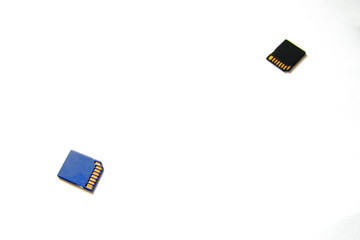 Two flash memory cards on a white background. Blue and black memory cards for cameras and other...
