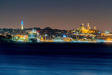 Is tanbul city and Mosque at night in Turkey. and Yacht