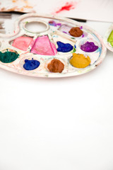Wooden art palette with paints