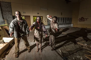 Fotobehang Zombies attack in an abandoned dark building © vadimborkin