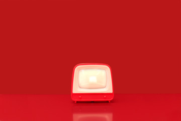 Set with vintage television in a red background