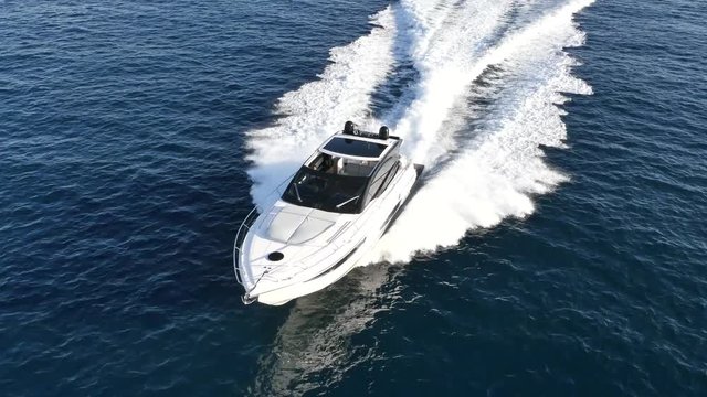 luxury motor boat in navigation aerial view