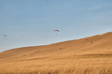Paragliding in autumn at sunset