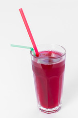 berry juice with straw on white background