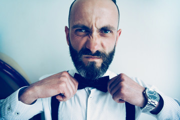 close up. man straightening his bow tie