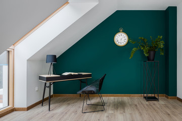 Home office with emerald wall