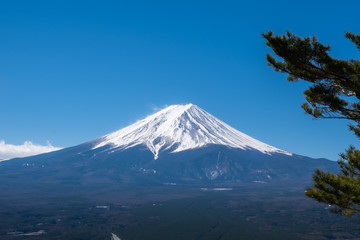 View of Mount Fuji, commonly called Fuji san in Japanese, Mount Fuji's exceptionally symmetrical cone, which is snow capped for about five months a year. It is a well known as the symbol of Japan.
