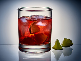 glass with drink and lime