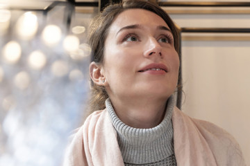 Woman in pink scarf at a restaurant