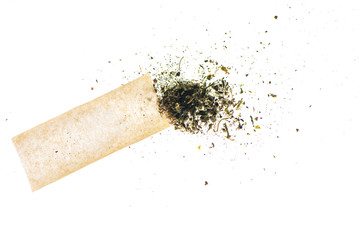 Marijuana bud and cigarette rolling paper on white background.