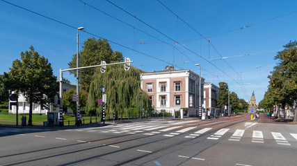 Fototapeta na wymiar the Hague street with pedestrian crossing and tram tracks, netherlands