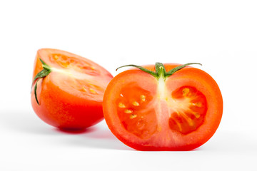 small tomato cut, close-up, on white background