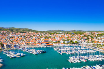 Fototapeta na wymiar Town of Vodice, marina and turquoise coastline on Adriatic coast, aerial view, Croatia