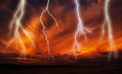 Lightnings during a thunderstorm on a sunset