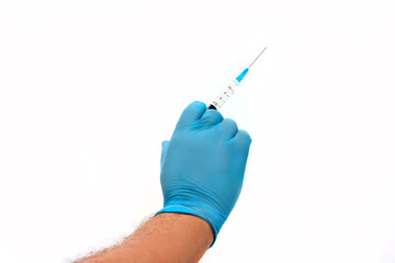 Men's hand in blue latex glove holding syringe isolated on white background