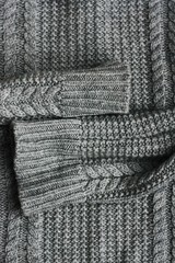 Beautiful knitted grey sweater close up view
