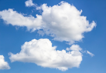 Naklejka na ściany i meble a clouds in the blue sky
