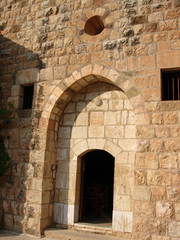 Fototapeta na wymiar KADISHA VALLEY,LEBANON - CIRCA OCTOBER, 2009 -The monastery of Mar Elisha is perched on the cliff. Kadisha Valley, Lebanon