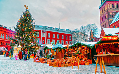 European Christmas market in winter Riga in Latvia. Winter. Late at evening. Street and holiday...