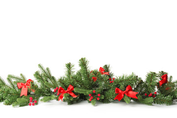 Beautiful Christmas tree branches with decor on white background