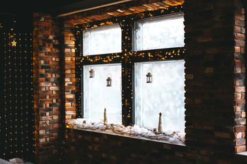 Christmas tree with many light bulbs and golden black decoration