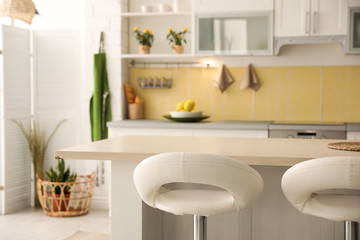 Fototapeta na wymiar Modern kitchen interior with stylish white furniture