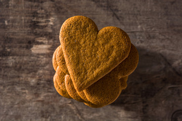 Heart shaped cookie on wooden table. Valentine's Day and Mother's Day concept.	