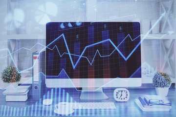 Forex graph hologram on table with computer background. Double exposure. Concept of financial markets.