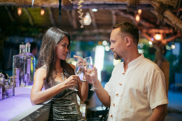 The couple celebrate the New Year at the bar behind the bar.