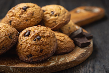 Homemade chocolate chips butter cookies, on wooden background.