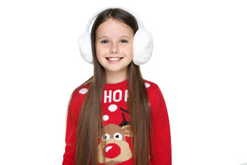 Little girl in christmas sweater and earmuffs isolated on white background - obrazy, fototapety, plakaty